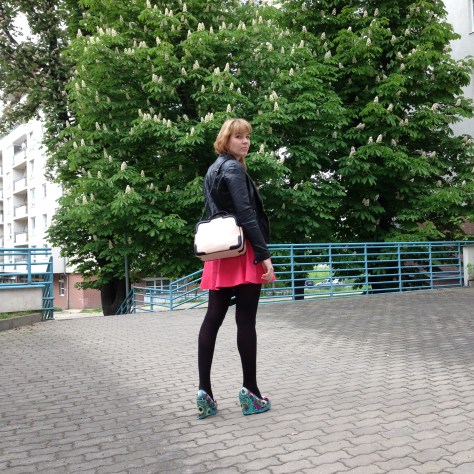 pink dress and a black motorcyckle jacket