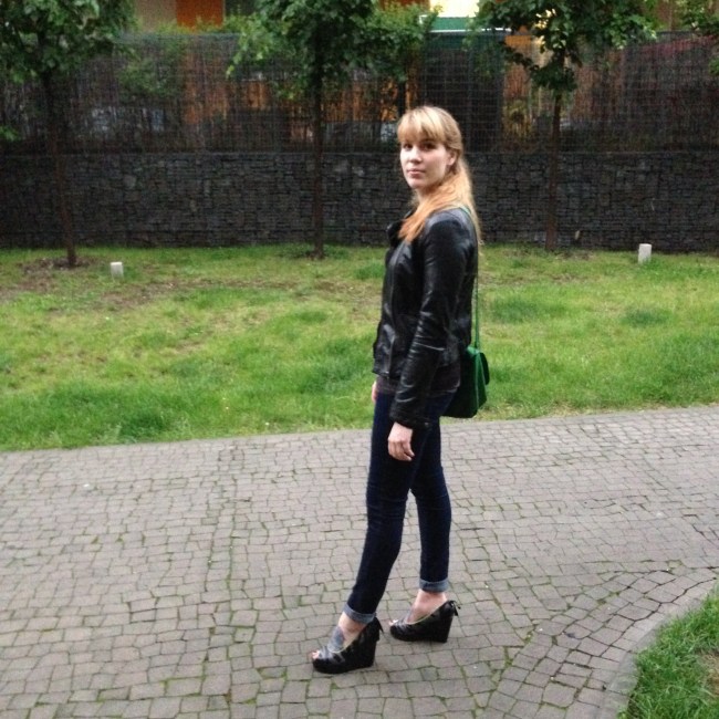 wearing iron fist wedges and skinny jeans and a fake leather jacket