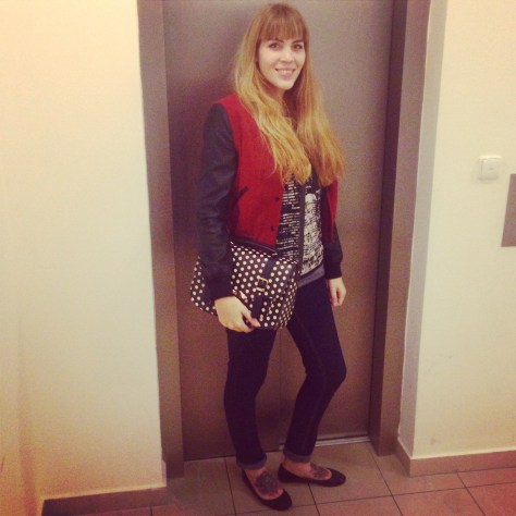 blogger outfit: skinny jeans, baseball jacket, polkadot bag and studded shoes